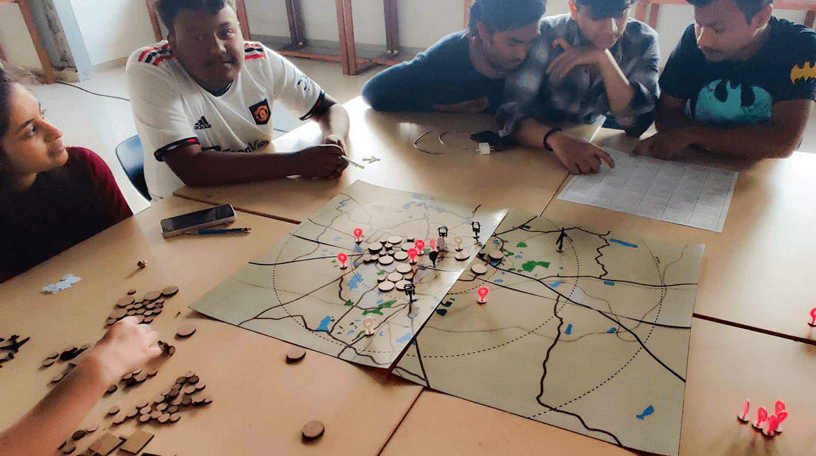 People testing the urban simulation board game