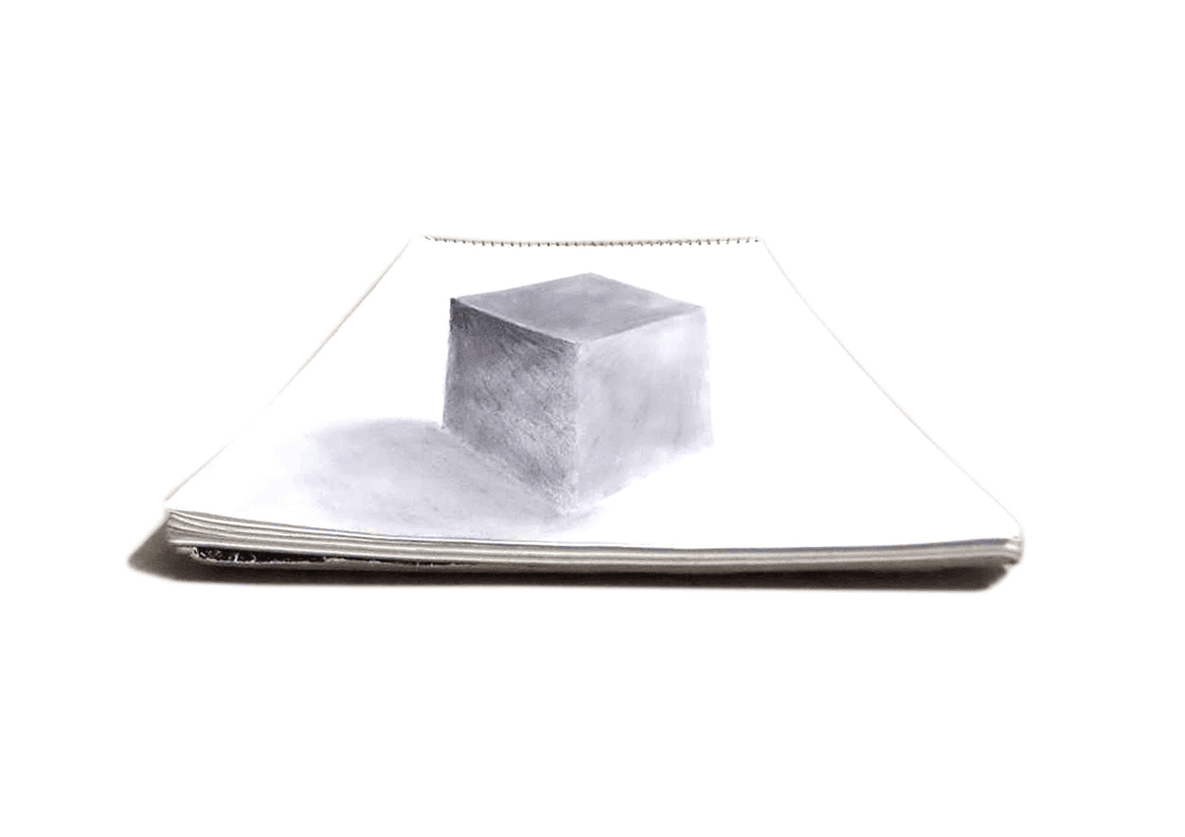 Graphite study of a cube on a sketchbook