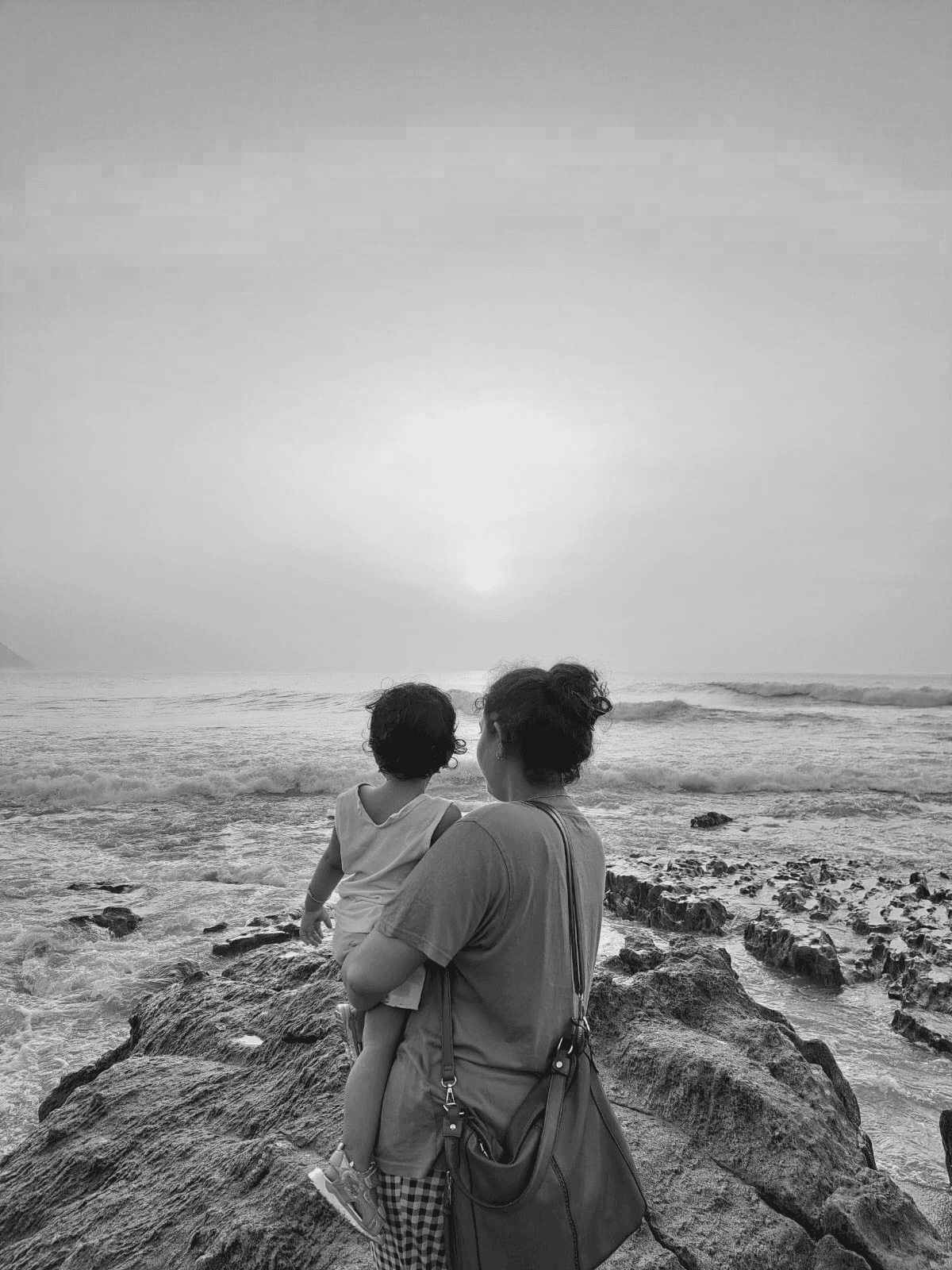 Chandra outdoors with a companion by the sea